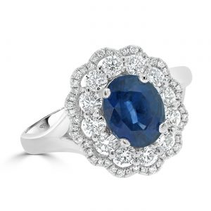 Diamond flower halo with an oval sapphire