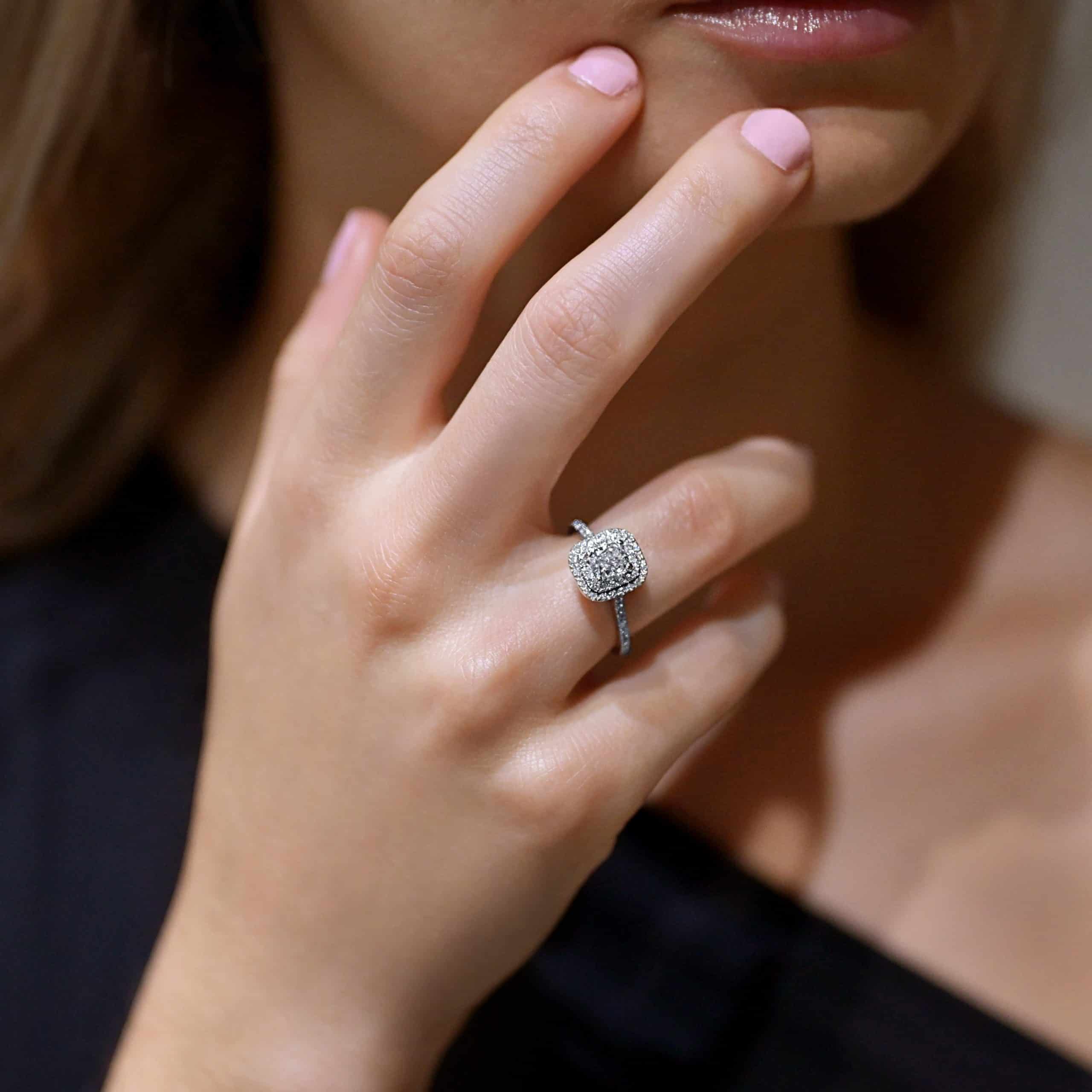 Cushion cut diamond ring with double halo