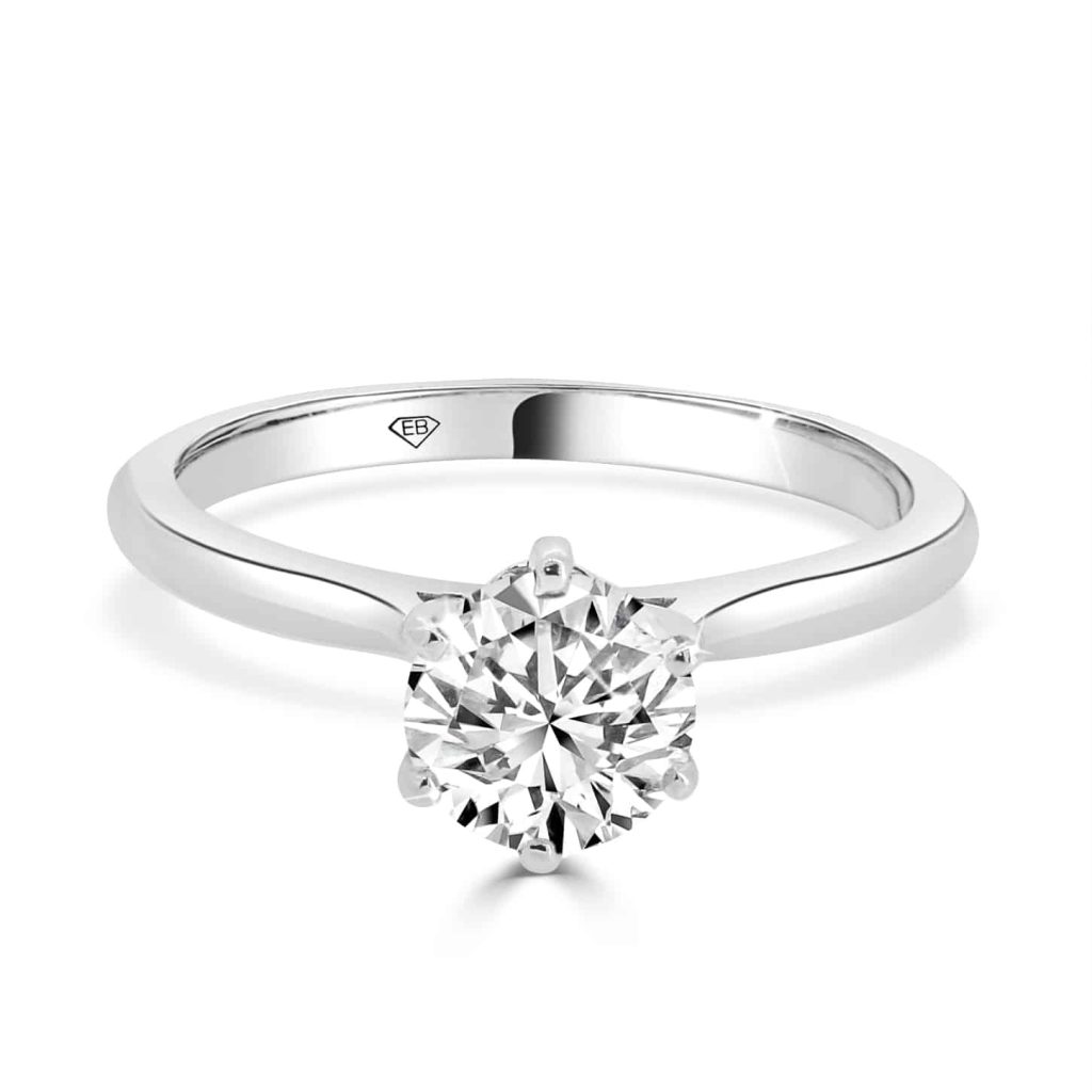 Classic round brilliant solitaire engagement ring in white gold with four-prong setting