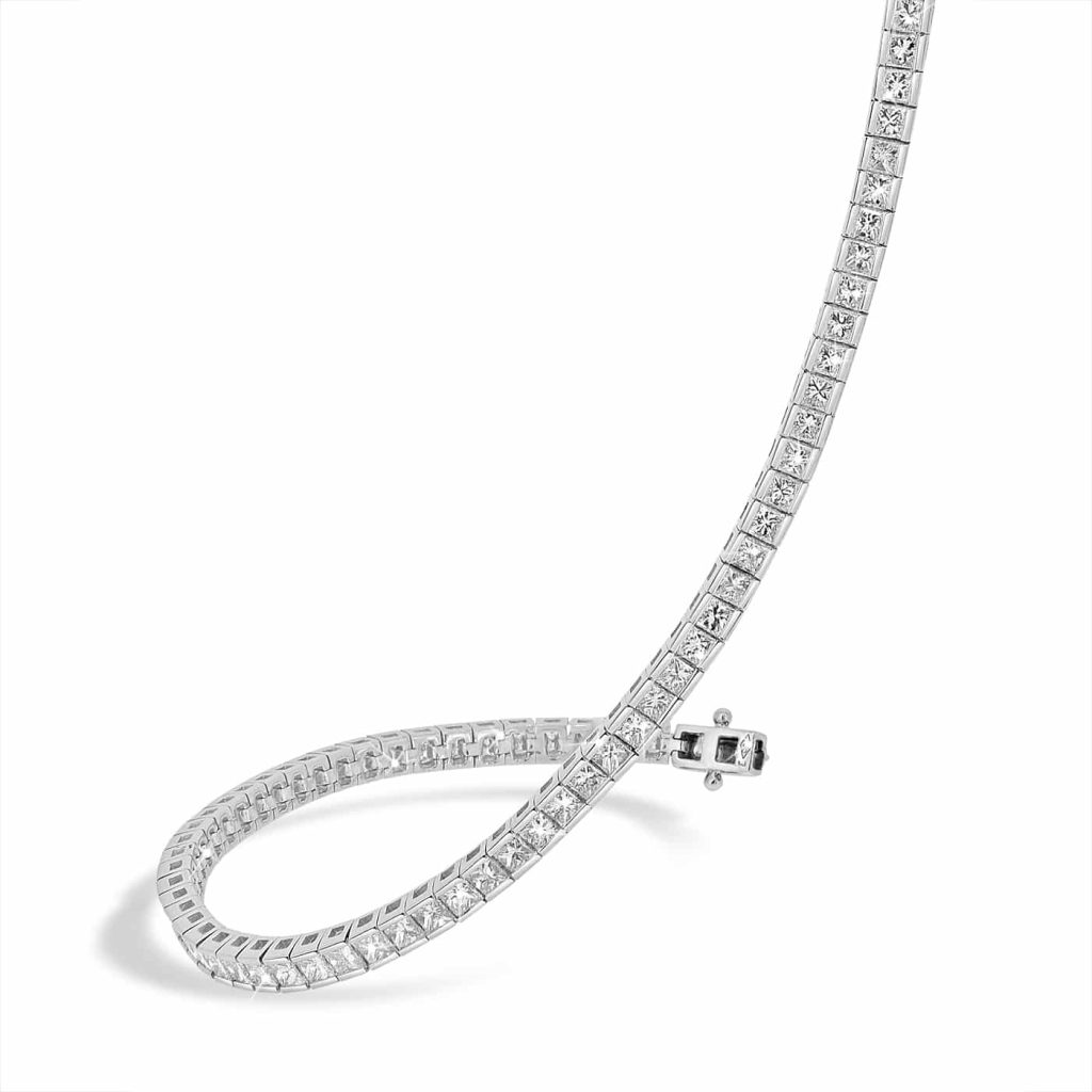 Princess-cut diamond tennis bracelet with channel setting in 18ct white gold.