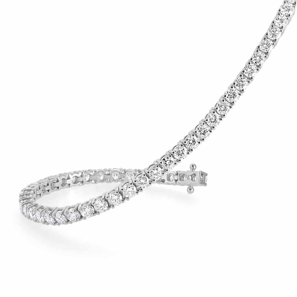 Diamond tennis bracelet featuring round brilliant diamonds in 18ct white gold.