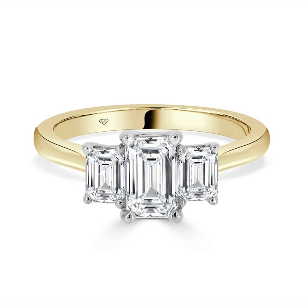 Emerald trilogy engagement ring