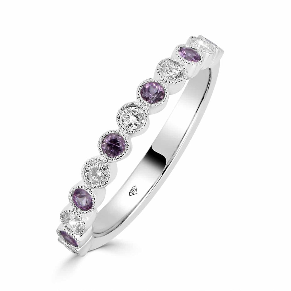 Diamond and pink sapphire wedding ring in 18ct white gold with vintage-inspired bezel settings.