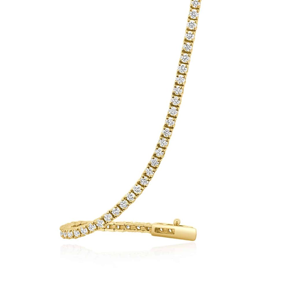 Yellow gold tennis bracelet with natural diamonds