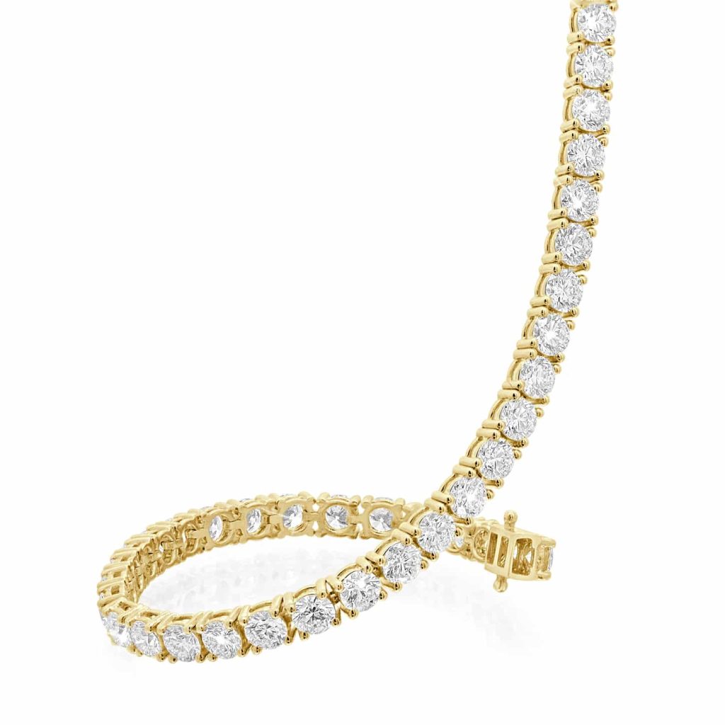 Gold tennis bracelet with natural diamonds