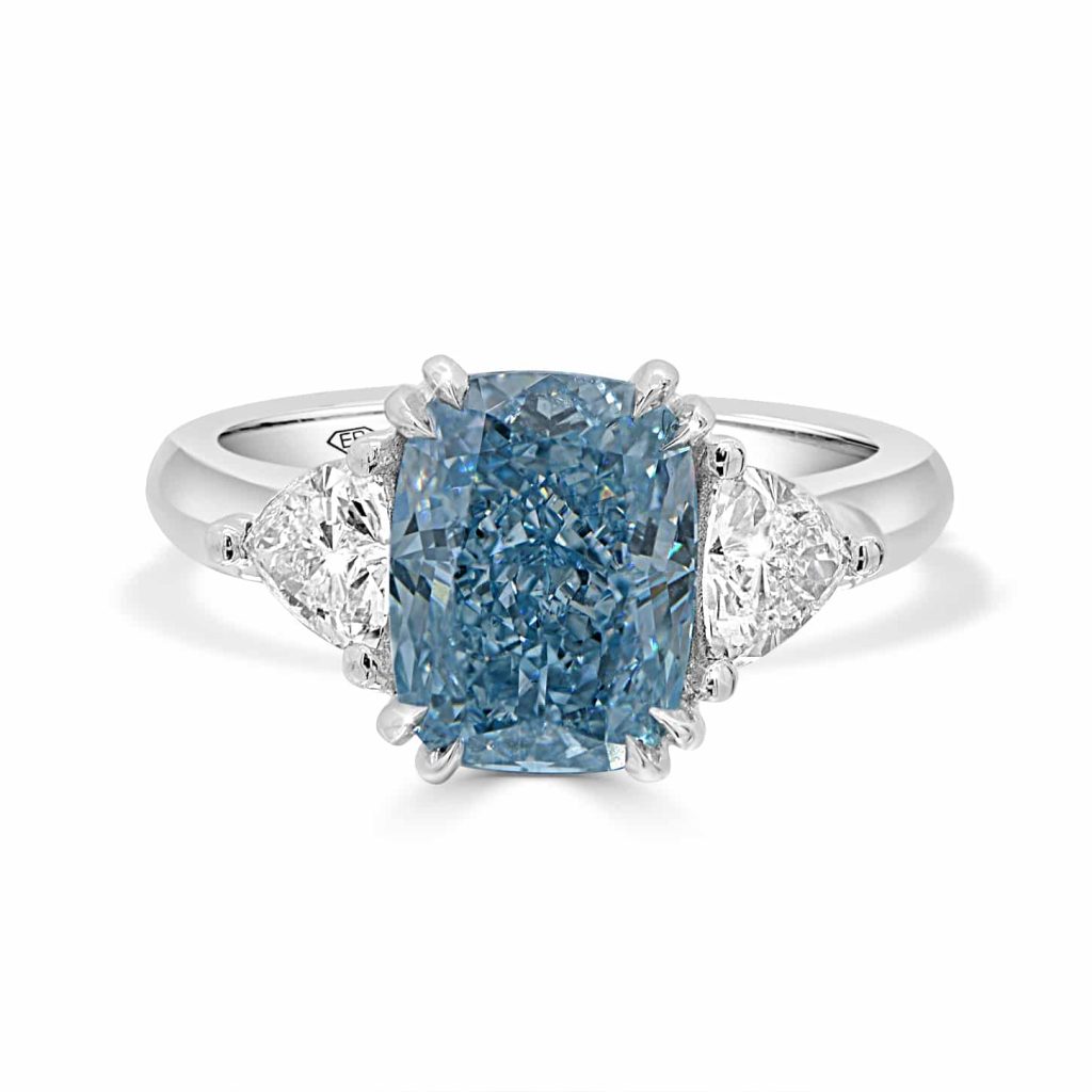 ab diamond ring with cushion-cut blue centre stone