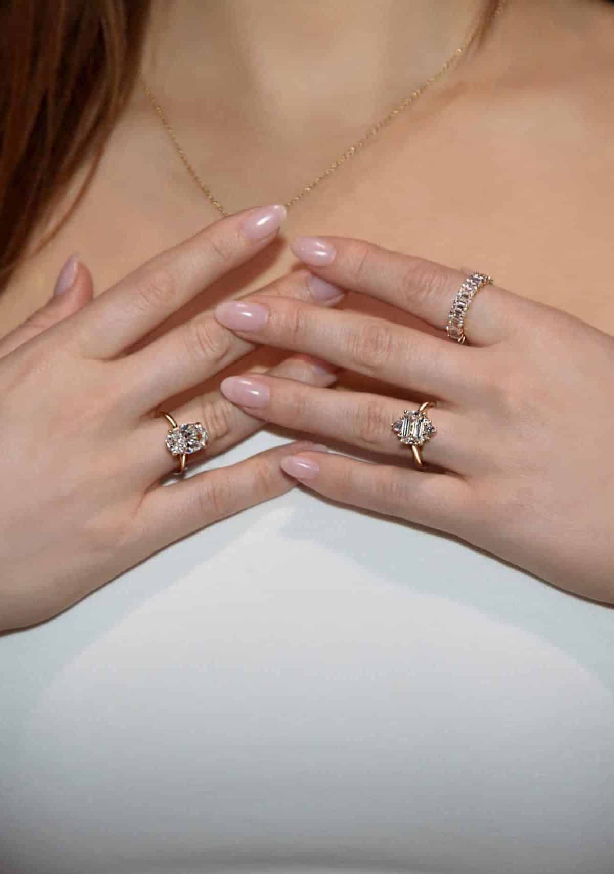 Elegant hands adorned with rings.