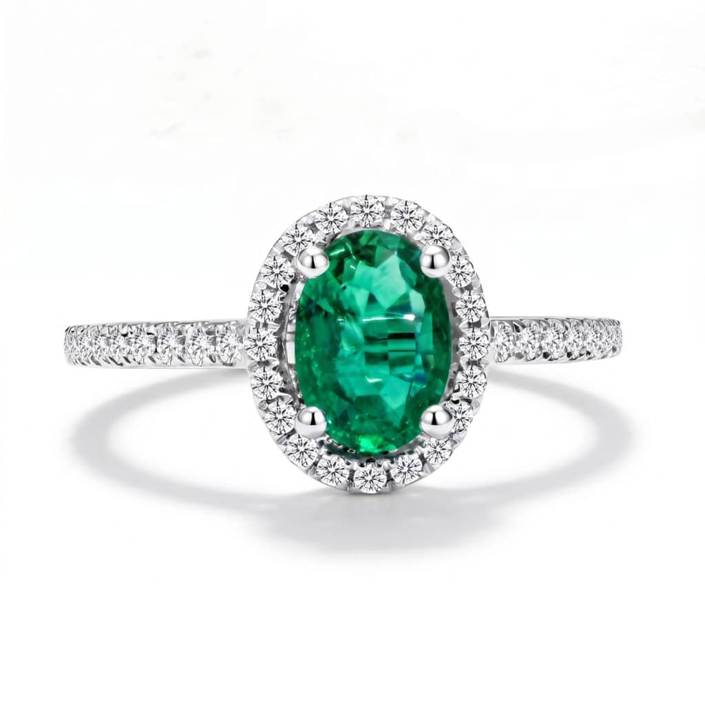 Emerald diamond ring with oval emerald and diamond halo in 18ct white gold